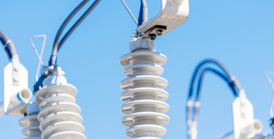 Photo of a close up of the top of a power pole