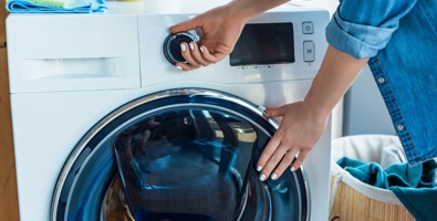 Photo of a washing machine being turned on.