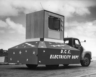 Black and white photo of a float representing the DCC Electricity Department in the 1961 Dunedin Festival