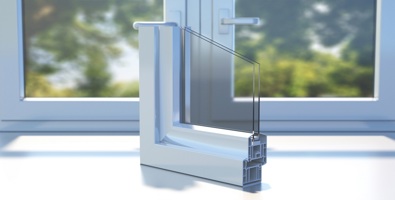 Photo of PVC aluminum profile frame double glazing cross section on a closed window sill. 