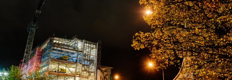 Night cityscape, long exposure showing a building being constructed and fully lit up at the university campus in Dunedin.