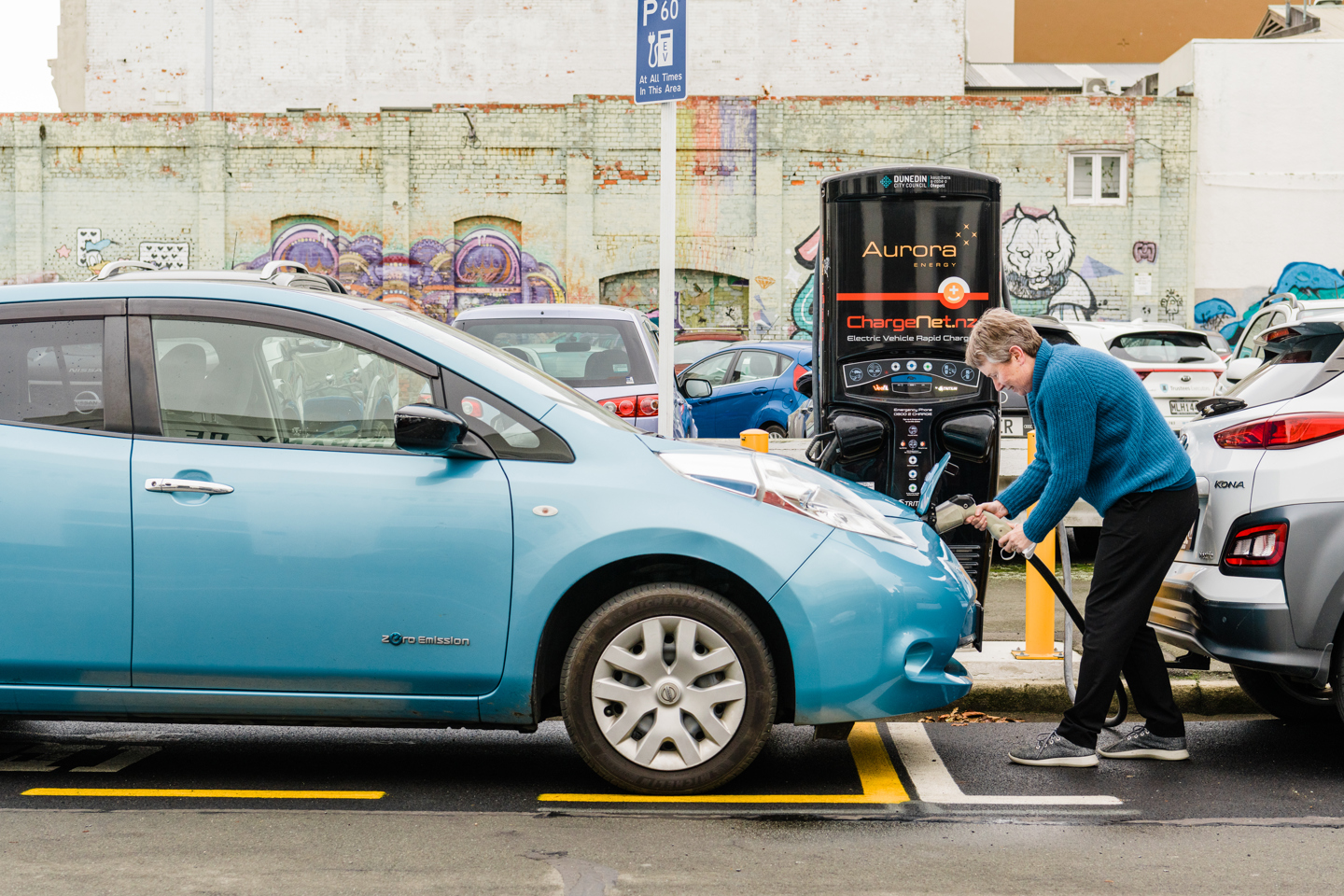 A photo of a person charging their electric car at one of our fast chargers.