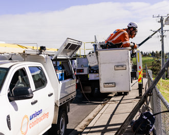 Unison truck and workers in elevated work platforms in Brighton