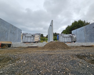 Progress photo of concrete foundations and walls 