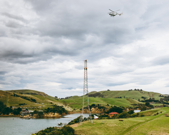 Helicopter coming in to remove part of a tower on Quarantine Island Kamau Taurua