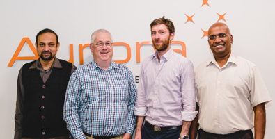 Photo of four Aurora Energy team members