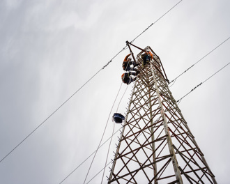 View from base of a tower on Goat Island with workers climbing it