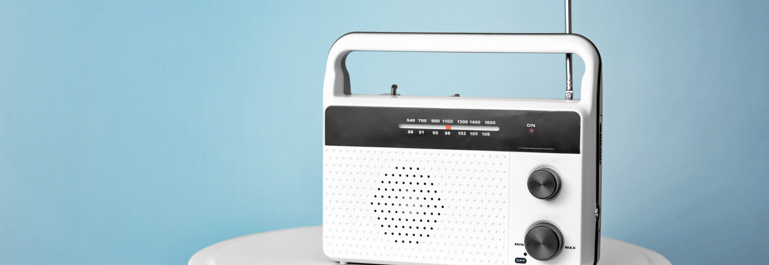 Retro battery-powered radio on a stool