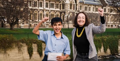 Woman and school boy pumping the air over Otago Science Fair win.