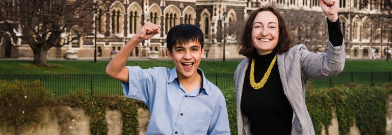 Woman and school boy pumping the air over Otago Science Fair win.
