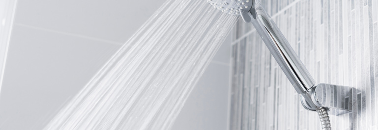 Bathroom shower head spraying water
